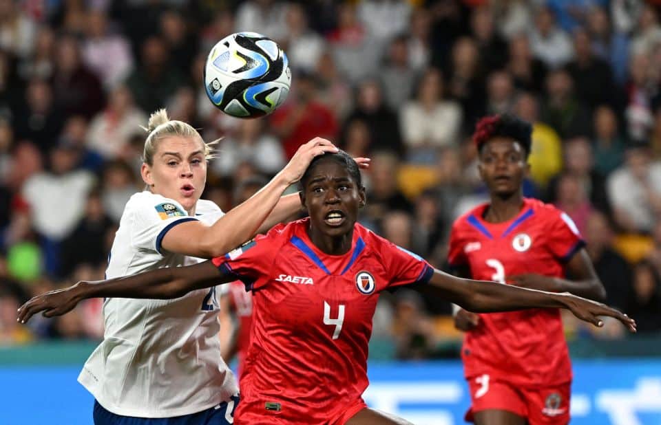 England's Alessia Russo and Haiti's Tabita Joseph fight for the ball during the two sides' opening game on July 22. England's Lionesses, the reigning European champions, earned a scrappy 1-0 victory over the tournament debutants.