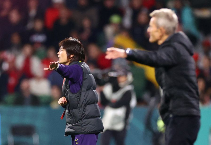 China head coach Shui Qingxia gestures during the match.