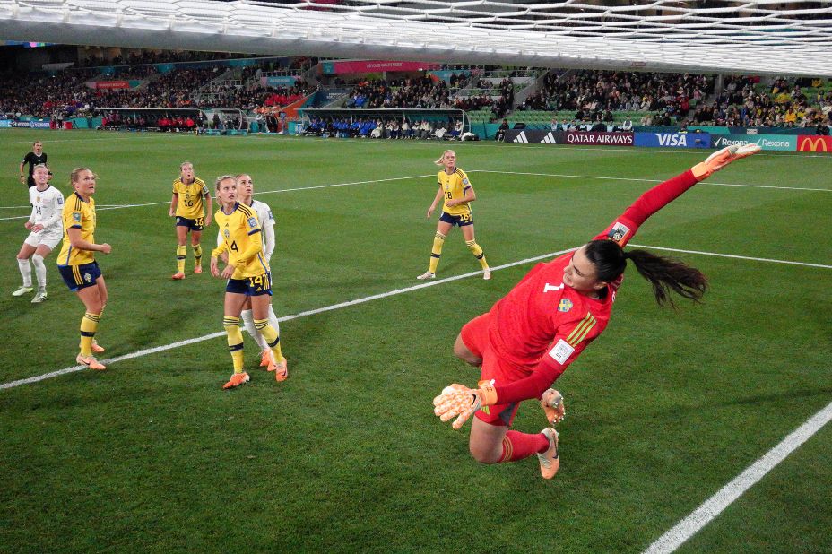 Swedish goalkeeper Zećira Mušović dives to save a Horan header. 